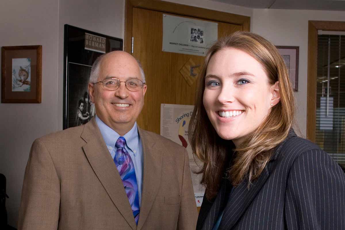 Ramsey County Attorney Office Director of Child Support Enforcement Division Mark Ponsolle and third-year law student Kirsten Zewers. 
